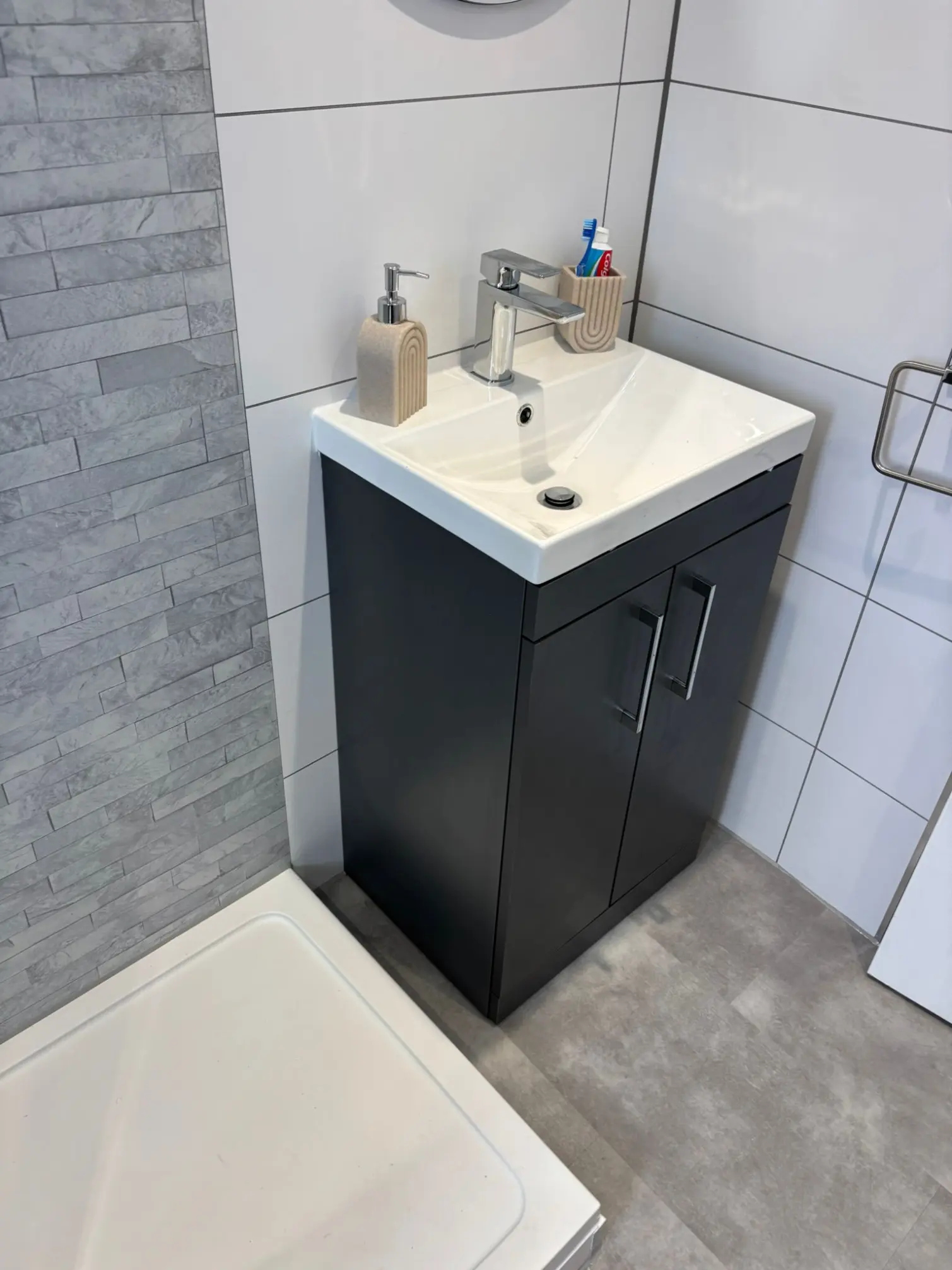 Anthracite vanity unit and stone feature tiles fitted by professional bathroom fitters in Edinburgh