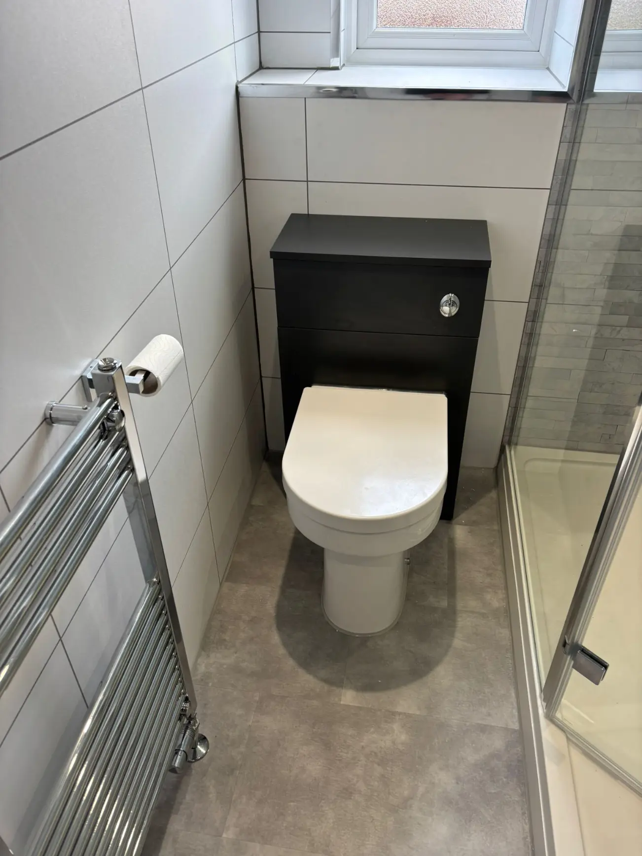 WC with anthracite concealed cistern unit and chrome heated towel rail in Stockbridge bathroom